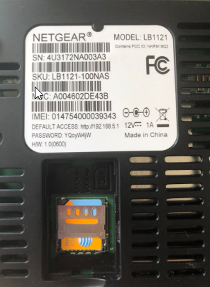 Netgear modem bottom showing IMEI label and SIM slot